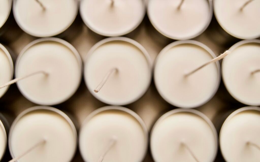 Rows of white candles for candle mold visual demo
