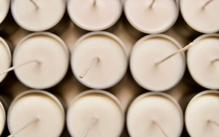 Rows of white candles for candle mold visual demo